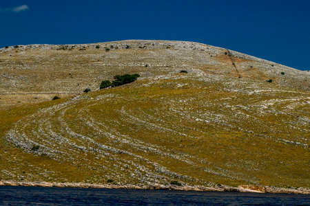 Property stone walls borders markers in Archipelago - Islands of the Kornati archipelago national...