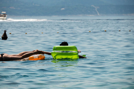 Snorkelist in crystal clear water of Adriatic sea in Brela on Makarska Riviera, Dalmatia Croatiaの写真素材