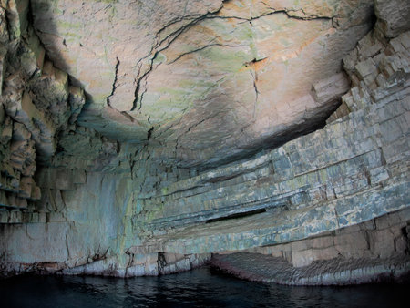 vis island croatia turquoise water and rock cliff, transparent clear sea water during a bright summer dayの写真素材