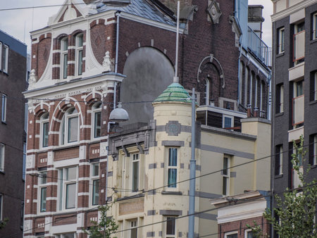 amsterdam ancient buildings over canals, netherlandsの写真素材