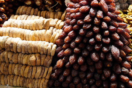 Some Dried figs and dates at the bazaar Istanbul market. Dried vegetables for use at winter time.の写真素材