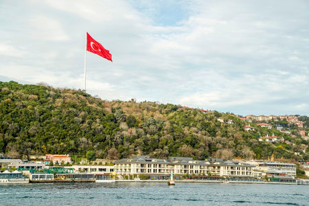 Trukish flag in Ortakoy district view from Istanbul Turkey, Bosphorus cruiseの写真素材
