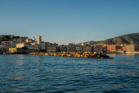 Village of Sestri Levante silence bay view from the sea at sunset Baia del Silenzio sea harbor and beach view Liguria, Italy.の写真素材