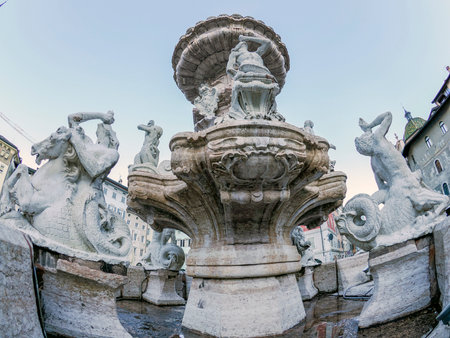 The Neptune fountain in Dome place in front of the Medieval Cathedral of San Vigilio in Trento, Italyの写真素材