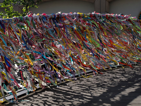 Love ribbons on the bridge over portuguese venice in Aveiro portugal moved by the windの写真素材