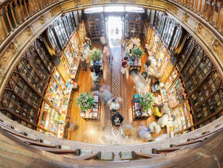 PORTO, PORTUGAL - APRIL 21 2024 Interior view of Lello bookstore in Portuguese with its wooden staircase famous for Harry Potter movieのeditorial素材