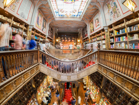 PORTO, PORTUGAL - APRIL 21 2024 Interior view of Lello bookstore in Portuguese with its wooden staircase famous for Harry Potter movieのeditorial素材