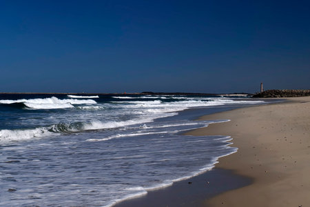 Sea waves on Aveiro Portugal sand dunes Atlantic Ocean beach view landscapeの写真素材