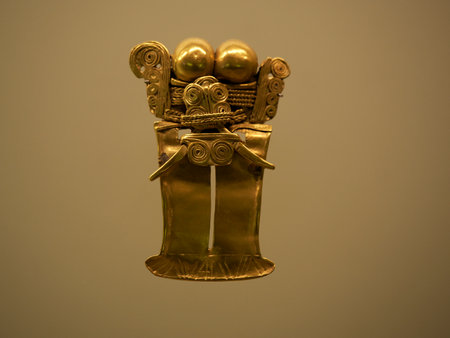 BOGOTA, COLOMBIA - JULY 3, 2024: Superb Gold artifacts on display in the Museo del Oro (Gold Museum). Isolated on backgroundのeditorial素材