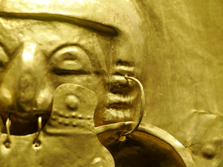 BOGOTA, COLOMBIA - JULY 3, 2024: Superb Gold artifacts on display in the Museo del Oro (Gold Museum). Isolated on backgroundのeditorial素材