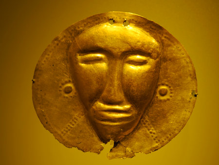 BOGOTA, COLOMBIA - JULY 3, 2024: Superb Gold artifacts on display in the Museo del Oro (Gold Museum). Isolated on backgroundのeditorial素材