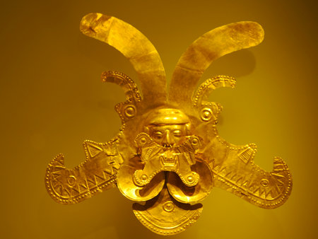 BOGOTA, COLOMBIA - JULY 3, 2024: Superb Gold artifacts on display in the Museo del Oro (Gold Museum). Isolated on backgroundのeditorial素材
