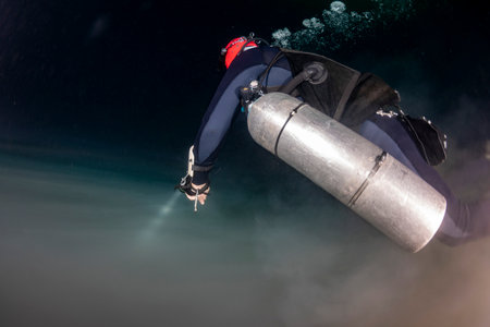 green gas cloud while Diving in Mexican Cenote underwater cave Tulumの写真素材