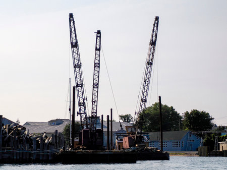 wood logs on pier in greenport harbor long island new york view panorama