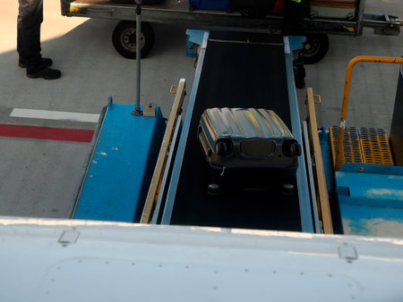A luggage being loaded into airplaneの写真素材