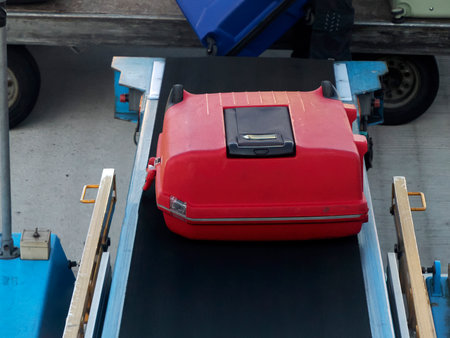 A luggage being loaded into airplaneの写真素材