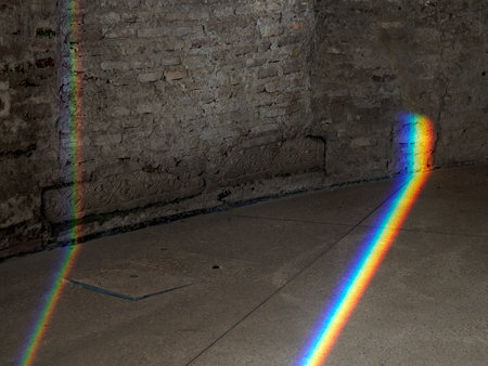 The Natural Light refraction in Rainbow inside ancient stone buildingの写真素材