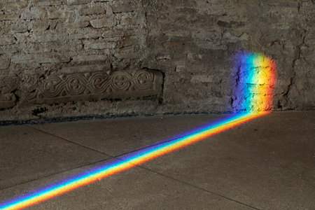 The Natural Light refraction in Rainbow inside ancient stone buildingの写真素材