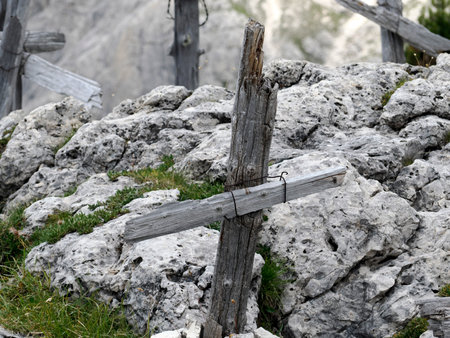 A detail of wooden cross of soldier died in first world war mountain cemetery in foxhole in Dolomites, Italyの写真素材