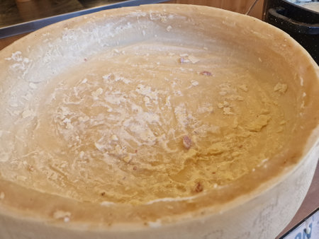 parmesan cheese cooking inside the wheel detailの写真素材