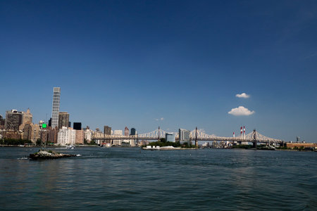 Queensboro Bridge in New York City, spanning the East River. new york manhattan view from east river boat cruiseの写真素材