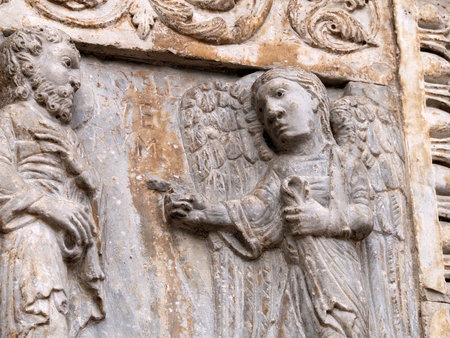 The San Zeno Basilica Church in Verona Italy, detail of exterior sculptures and bas reliefの写真素材