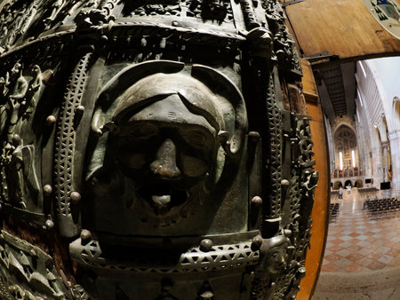 The San Zeno Basilica Church in Verona Italy, detail of exterior Iron door sculptures and bas reliefの写真素材