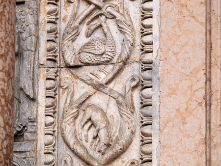 The San Zeno Basilica Church in Verona Italy, detail of exterior sculptures and bas reliefの写真素材