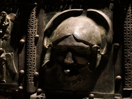 The San Zeno Basilica Church in Verona Italy, detail of exterior Iron door sculptures and bas reliefの写真素材