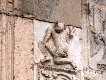The San Zeno Basilica Church in Verona Italy, detail of exterior sculptures and bas reliefの写真素材