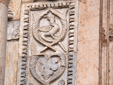 The San Zeno Basilica Church in Verona Italy, detail of exterior sculptures and bas reliefの写真素材