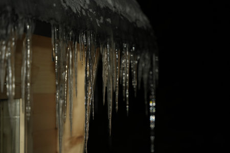 Icycles outside Kota Cabin in Lapland Finland on very cold icy winter night detailの写真素材