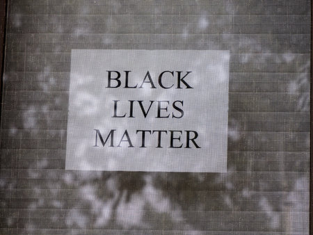 black lives matter sign outside window house