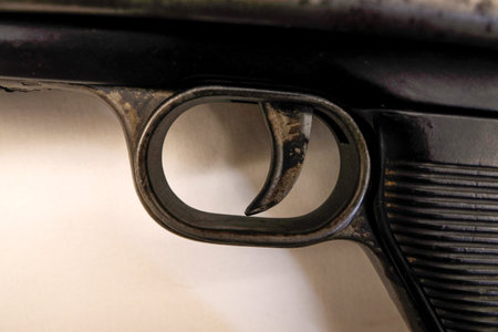 A pistol gun trigger detail close up