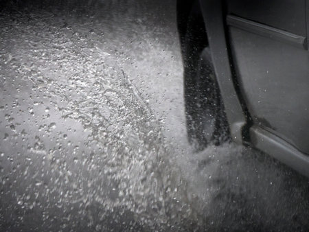 A Car tire aquaplaning under heavy rain detailの写真素材