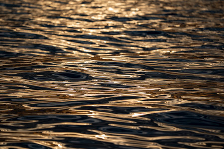 the sea reflection of sun at sunset abstract textureの写真素材