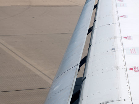 frontal airplane flaps on the wings detail close upの写真素材