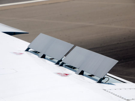 rear airplane flaps on the wings detail close upの写真素材