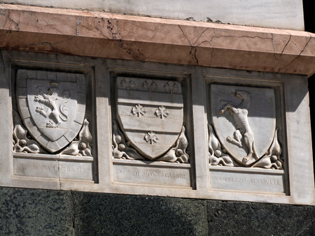 Florence dome church cathedral exterior detail of donors and family shieldの写真素材