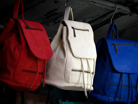 red white and blue colorful leather backpacks in florence street marketの写真素材