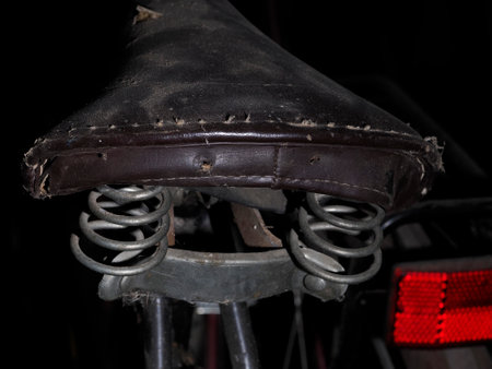 A saddle of old vintage ancient bicycle detail close upの写真素材
