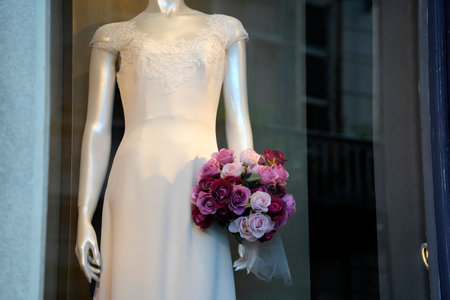 A bride luxury white dress in an atelier windowの写真素材