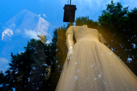 A bride luxury white dress in an atelier windowの写真素材