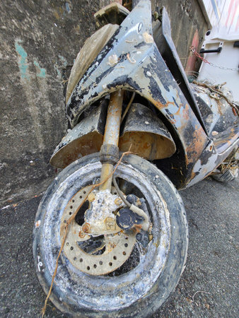 A Rusted encrusted motorbike recovered from the underwater seaの写真素材