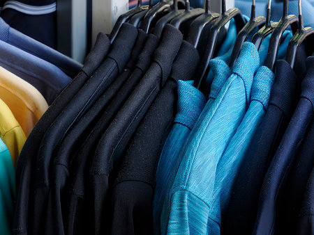 colorful clothes shirt hanging in street market store detail