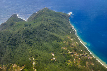 Punta chiappa in The Portofino promontory aerial view from airplane before landing to Genoaの写真素材