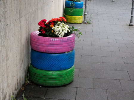 flowers inside colorful tires detail closeupの写真素材