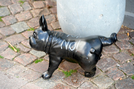 A Dog sculpture with a no peeing cautionの写真素材