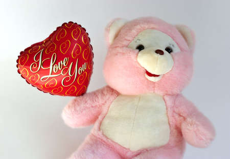 Teddy bear with heart balloonの写真素材
