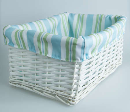 White, blue and green basket isolatedの写真素材
